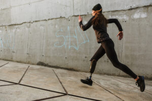 A woman with a prosthetic leg running.