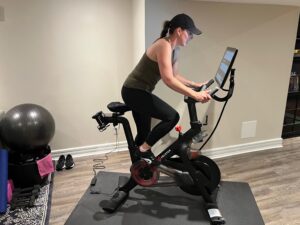 ParticipACTION employee Alison Carruthers exercising on a Peloton stationary bike. ParticipACTION employee Alison Carruthers exercising on a Peloton stationary bike.