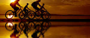 people biking on sunset