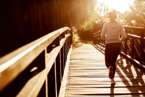 woman running on a bridge