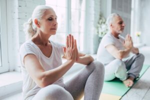 Elder generation sitting in yoga pose