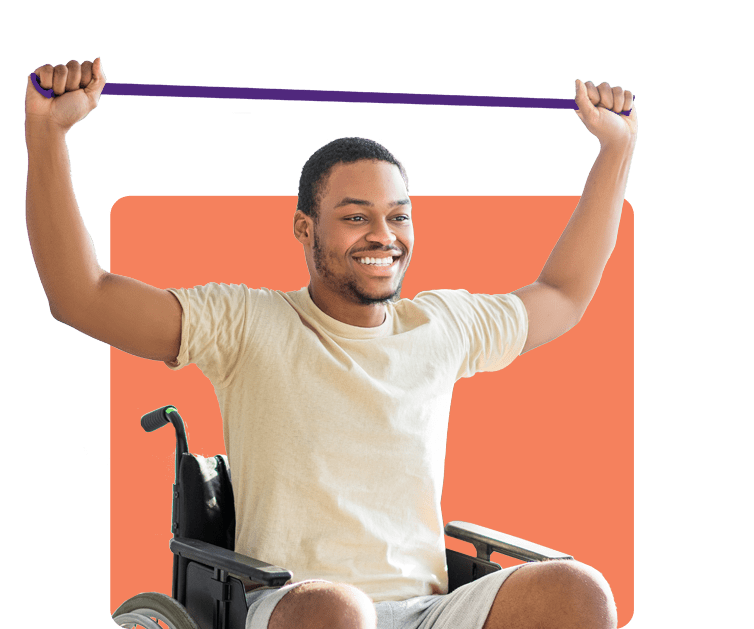  A smiling man using an exercise band over his head while seated in a wheelchair