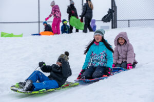 group of kids having fun in the snow