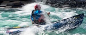 person paddling in the river