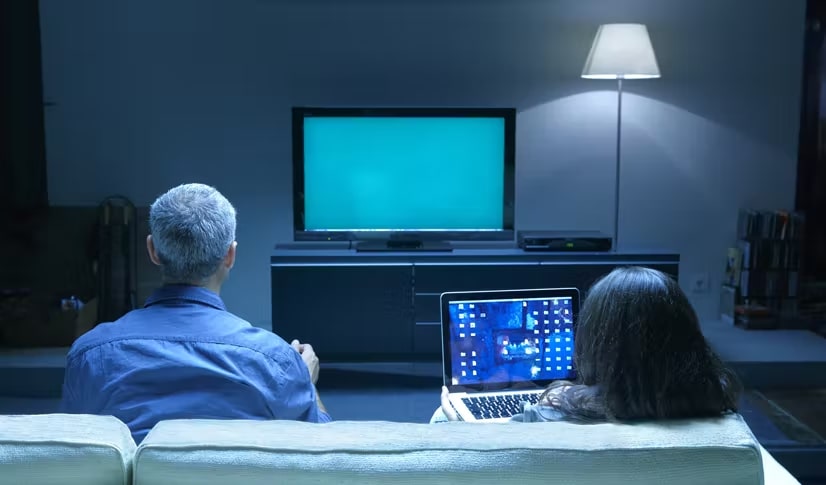 Seniors in front of a TV in their living room