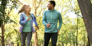 smiling couple running outdoor