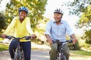 smiling people biking