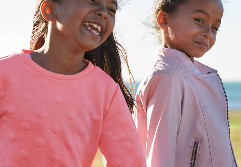 Two happy girls posing