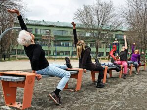 Group of women stretching outdoors