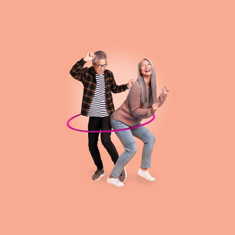 Couple hula-hooping together