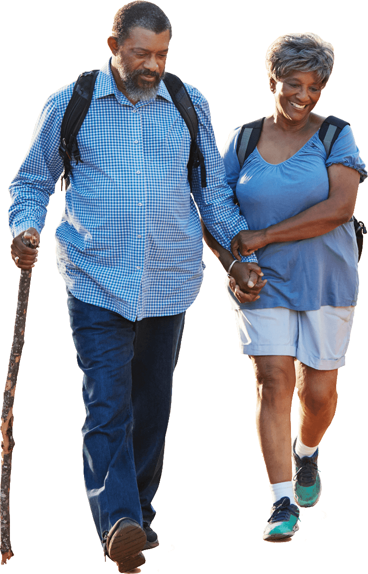 Senior aged couple hiking in sportwear