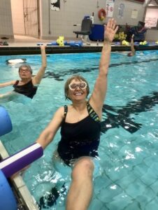 smiling senior woman swimming