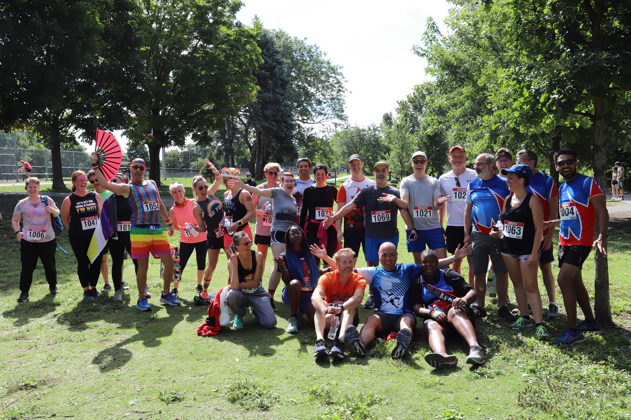Members of the Ottawa Frontrunners posing for a group photo in a park Members of the Ottawa Frontrunners posing for a group photo in a park