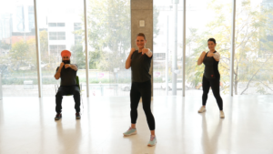 Three people doing boxing