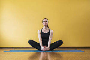 A woman doing the butterfly exercise.