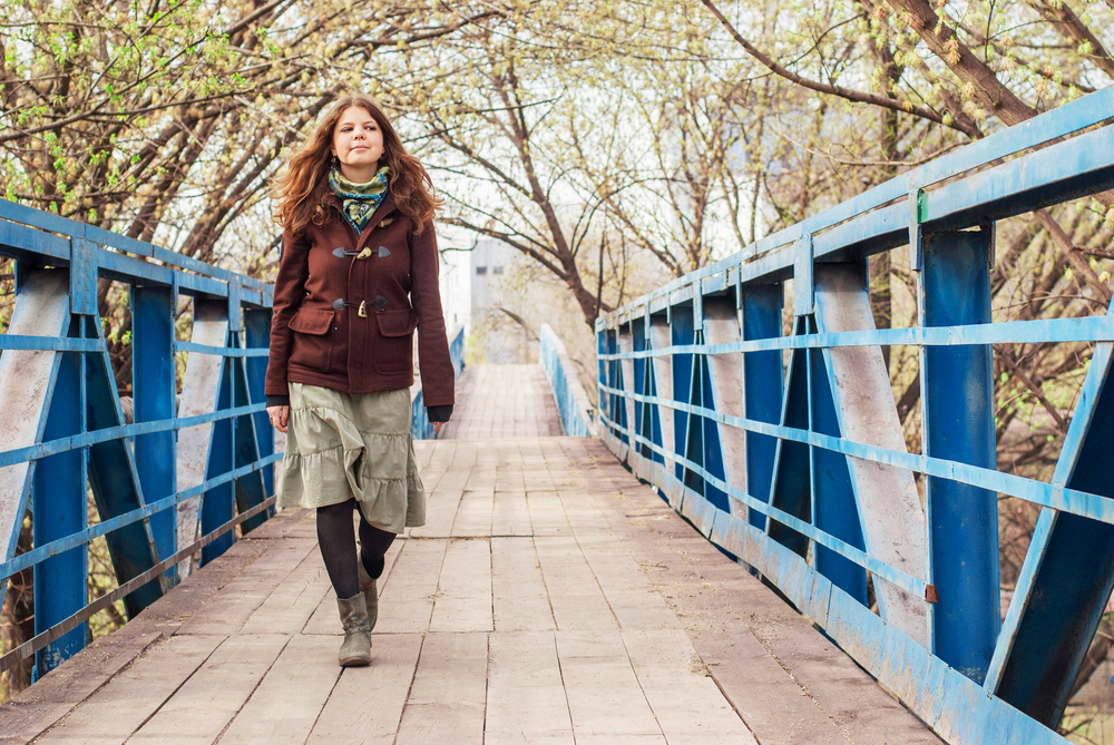A woman walking on bridge. A woman walking on bridge.