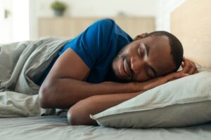 A man sleeping in bed.