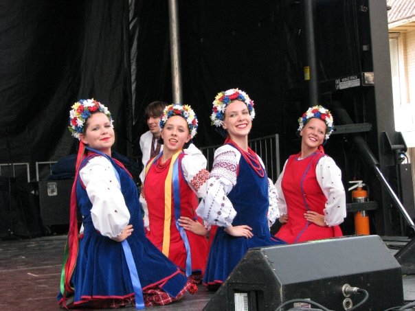 Stephanie Ehmke standing on a stage with three other Ukrainian dancers. Stephanie Ehmke standing on a stage with three other Ukrainian dancers.