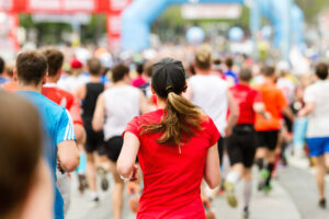 A group of people running in a marathon. 