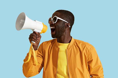 Man screaming into a megaphone