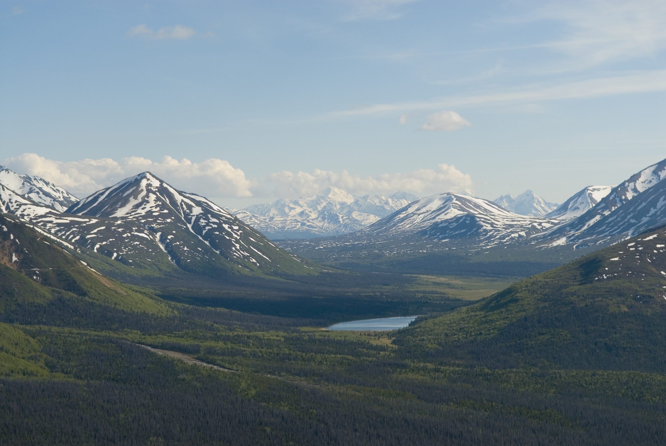 A lake surrounded by a mountain range.