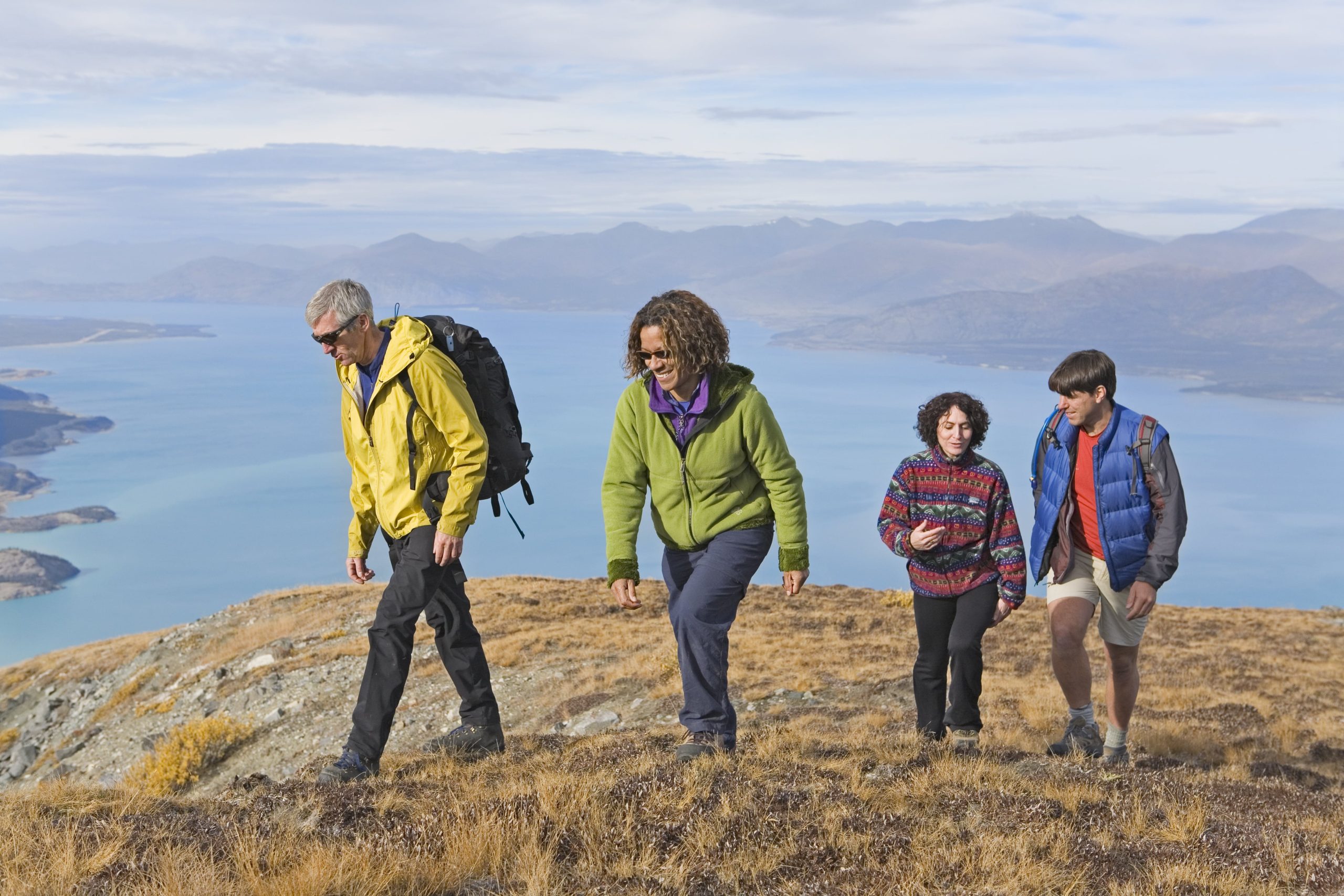 A group of people hiking on a mountain. A group of people hiking on a mountain.