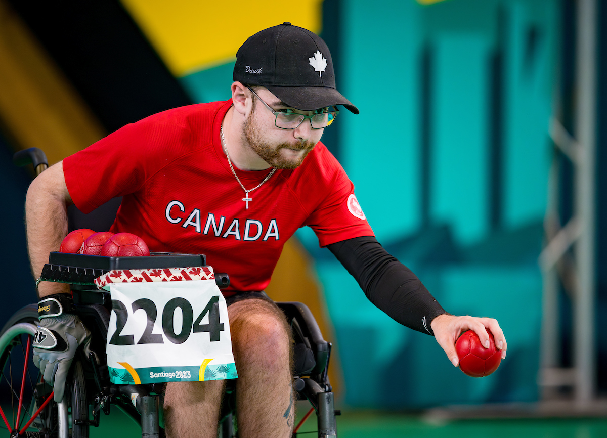 Paralympian Danik Allard getting ready to throw a boccia ball. Paralympian Danik Allard getting ready to throw a boccia ball.