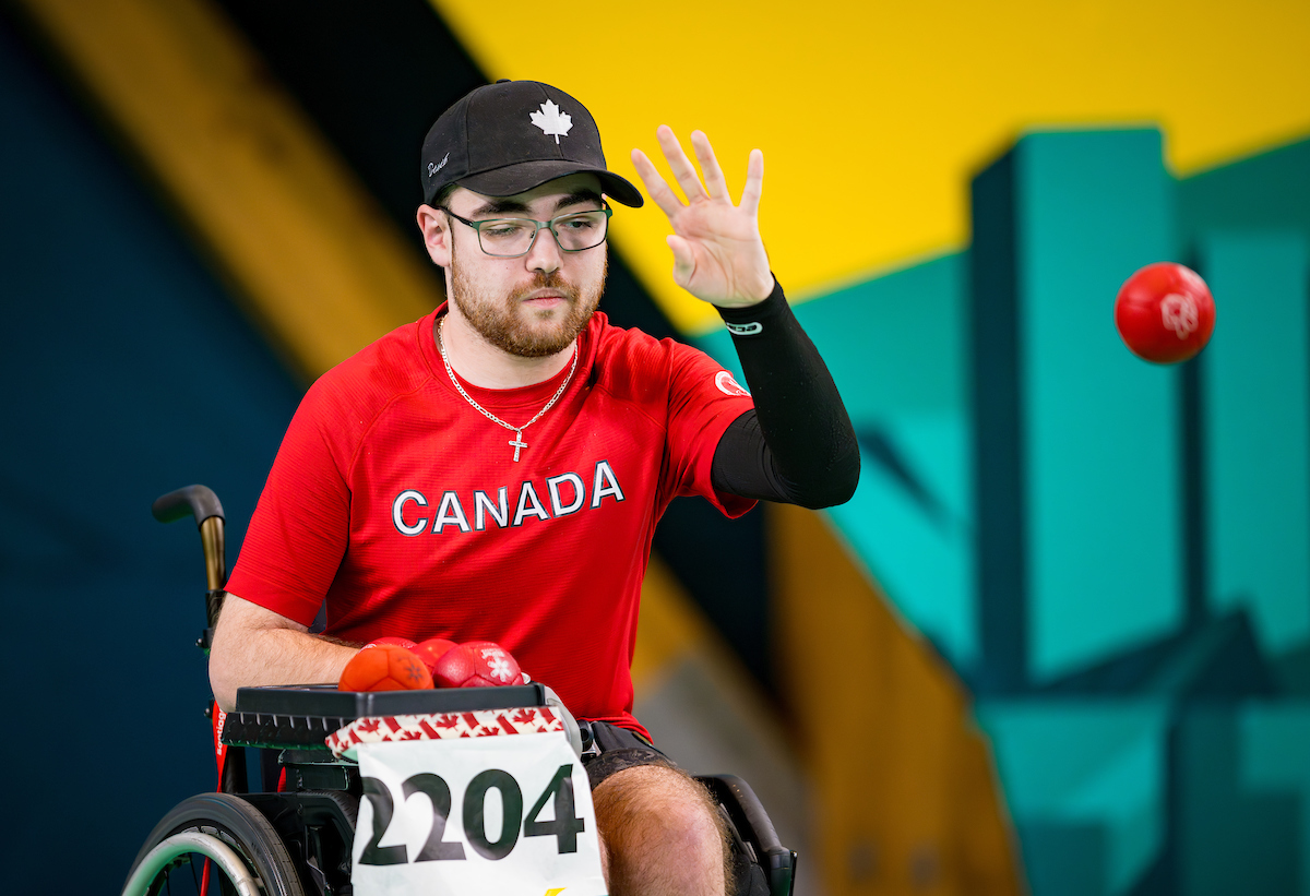 Danik Allard throwing a boccia ball. Danik Allard throwing a boccia ball.