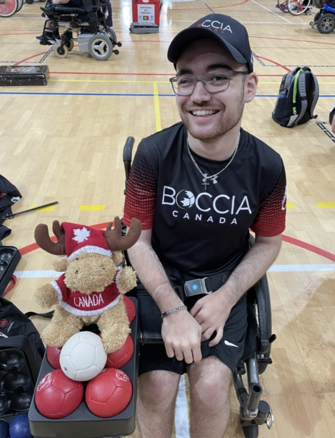Paralympian Danik Allard smiling in a gymnasium. Paralympian Danik Allard smiling in a gymnasium.