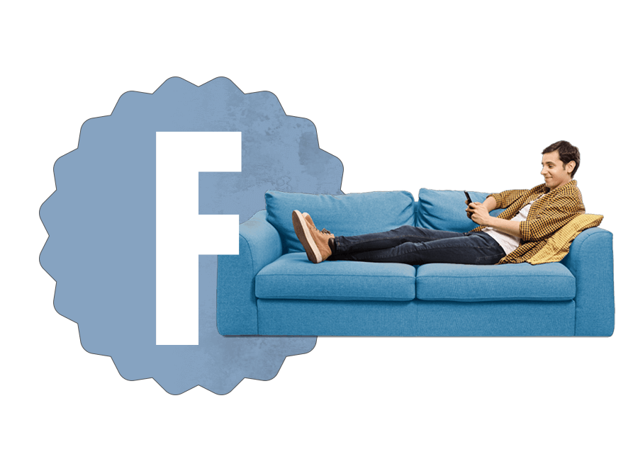 Grade F with a man resting no a couch looking at his phone Grade F with a man resting no a couch looking at his phone