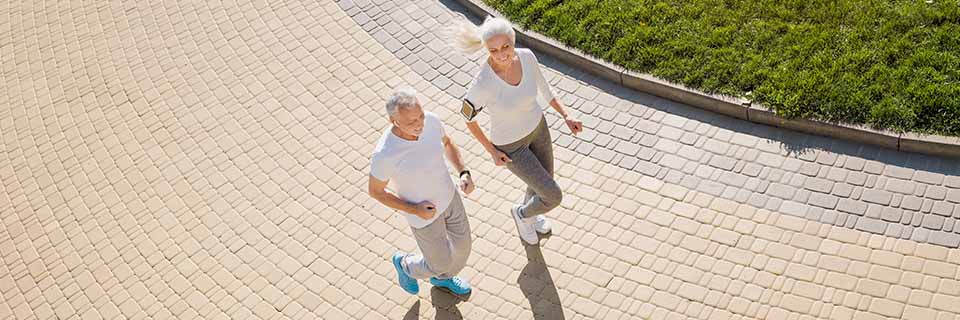 top-view-of-senior-woman-and-man-running top-view-of-senior-woman-and-man-running