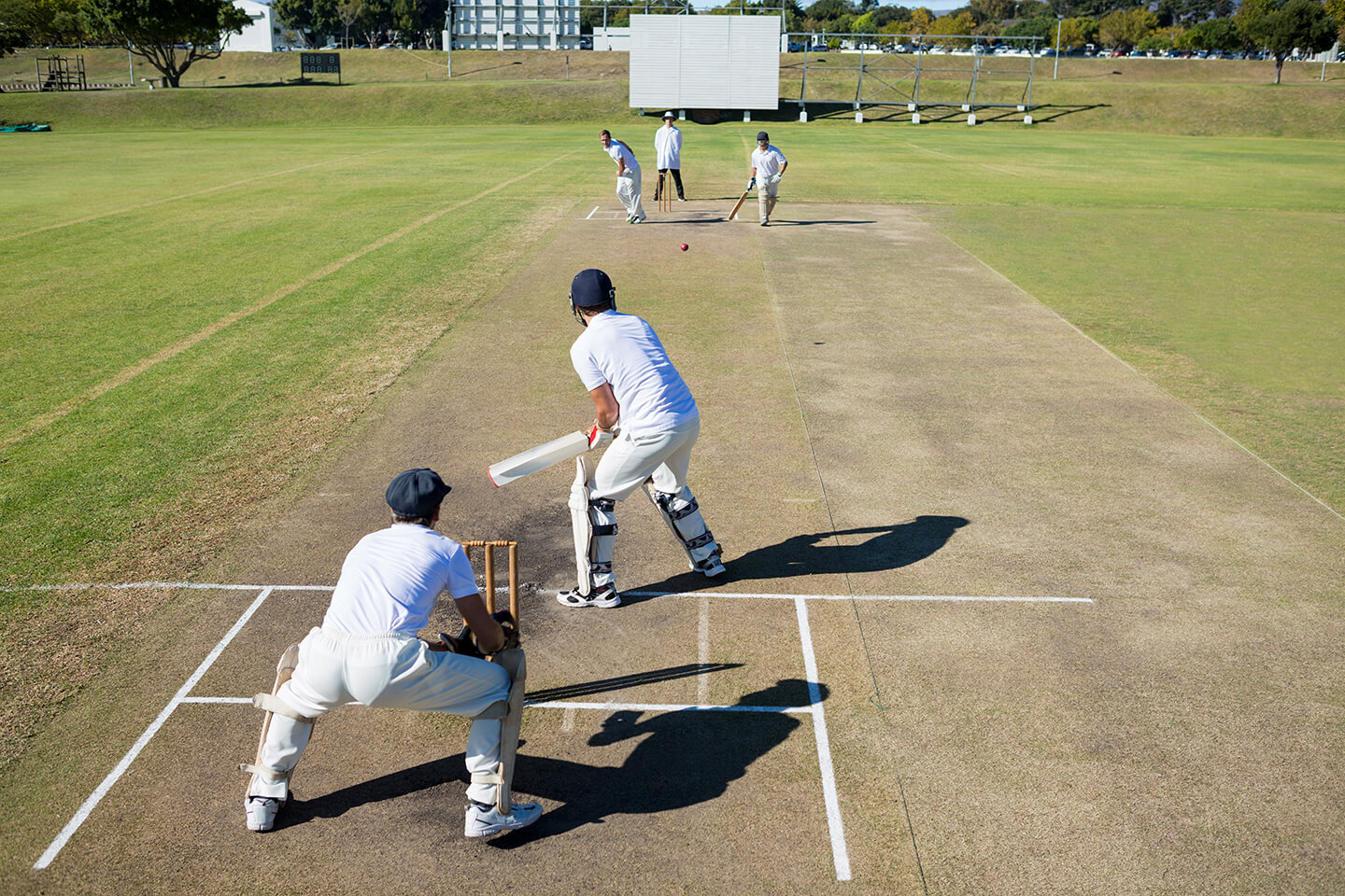 Two teams facing off in a cricket match Two teams facing off in a cricket match
