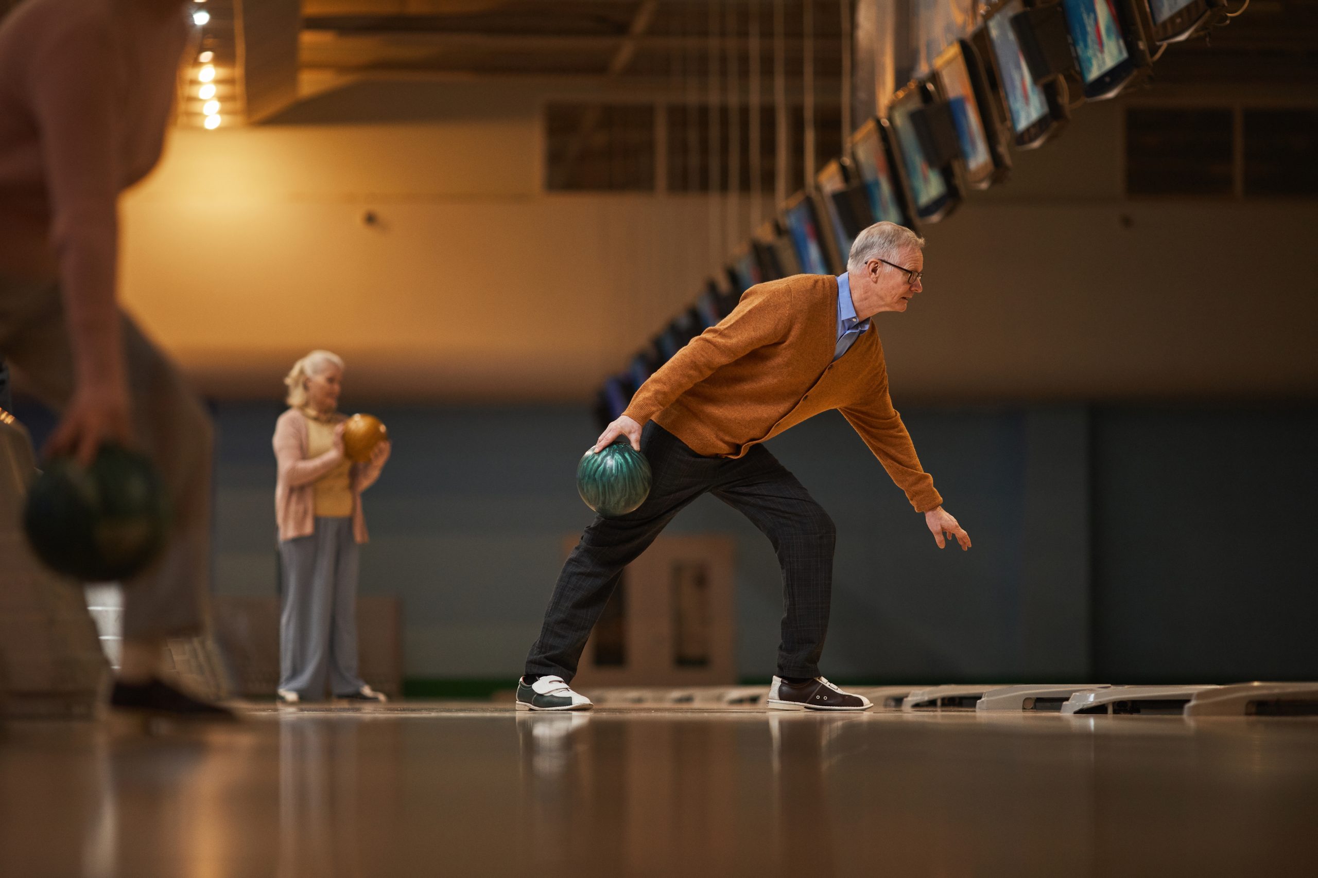 A man and woman bowling. A man and woman bowling.