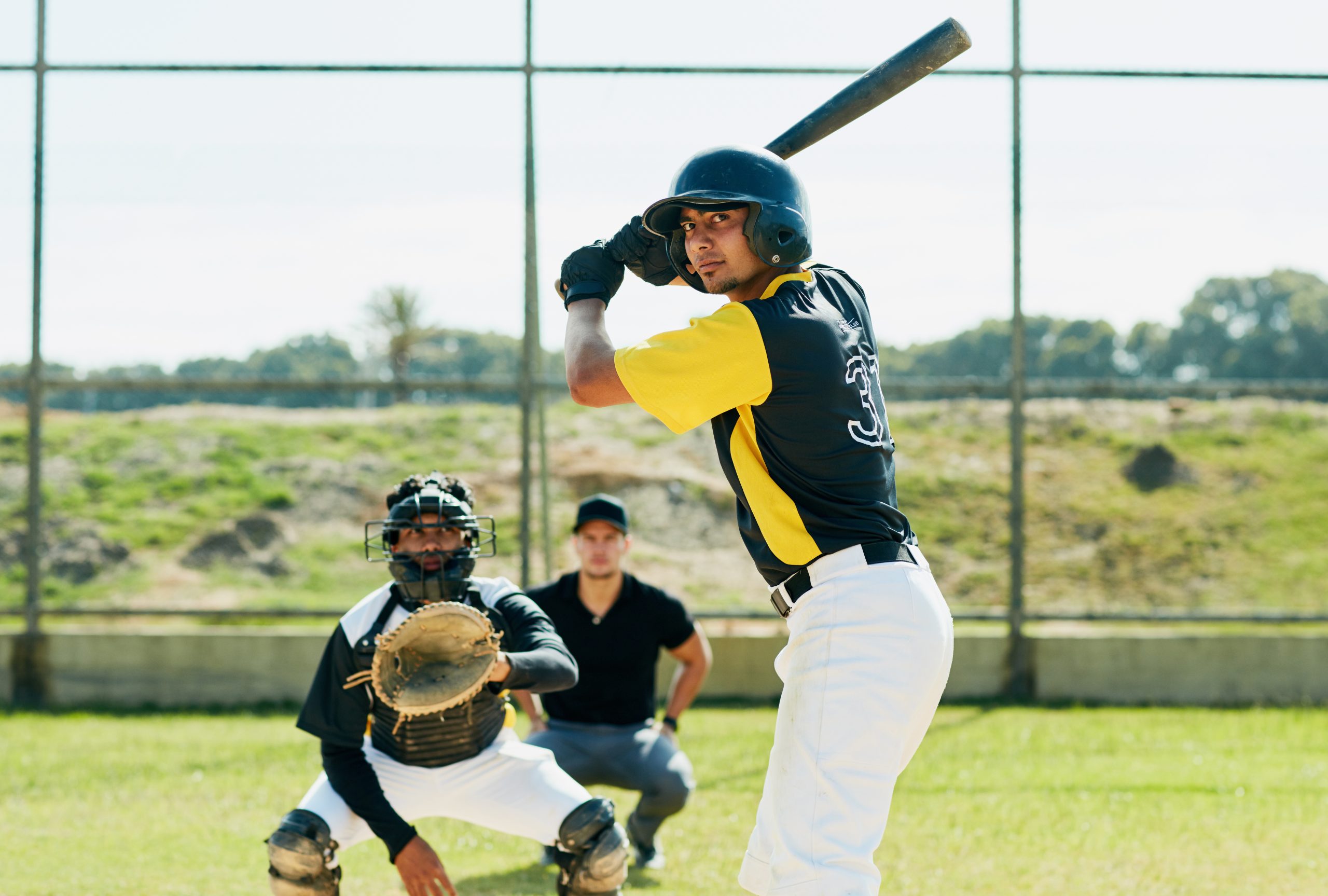 A male softball player getting ready to bat. A male softball player getting ready to bat.
